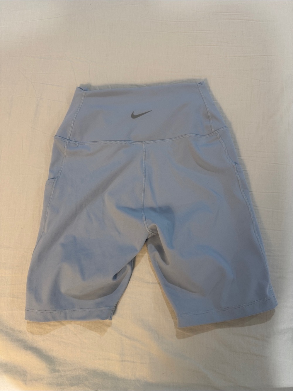 NWOT Nike Women's High-Rise Pastel Blue Bike Shorts with Nike Swoosh